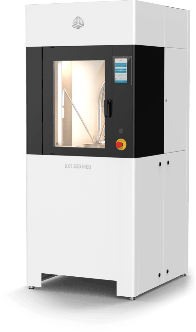 A large, white and black industrial 3D printer labeled EXT 220 MED with a transparent front door, touchscreen interface, and control buttons on the front panel.